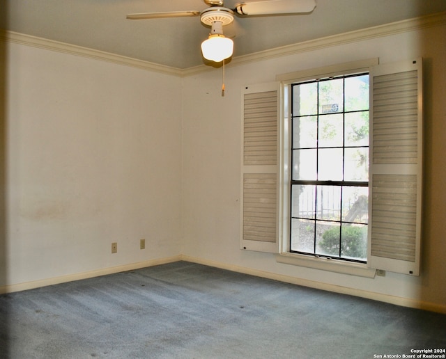 carpeted empty room featuring ceiling fan and crown molding