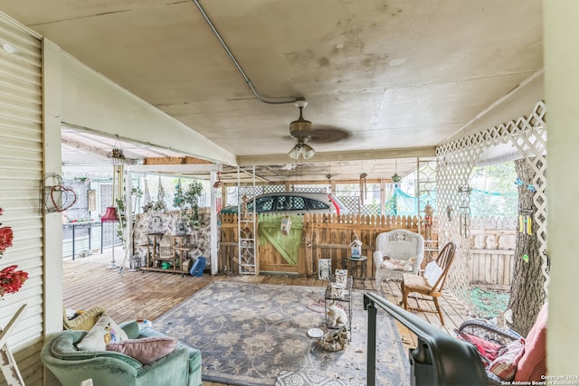 sunroom / solarium with ceiling fan