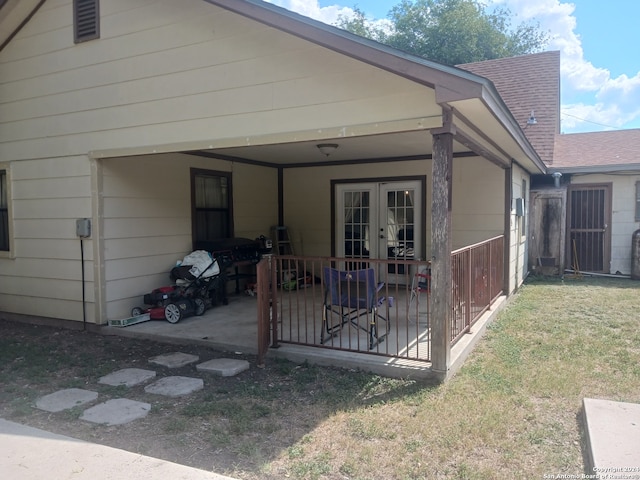 rear view of property featuring french doors