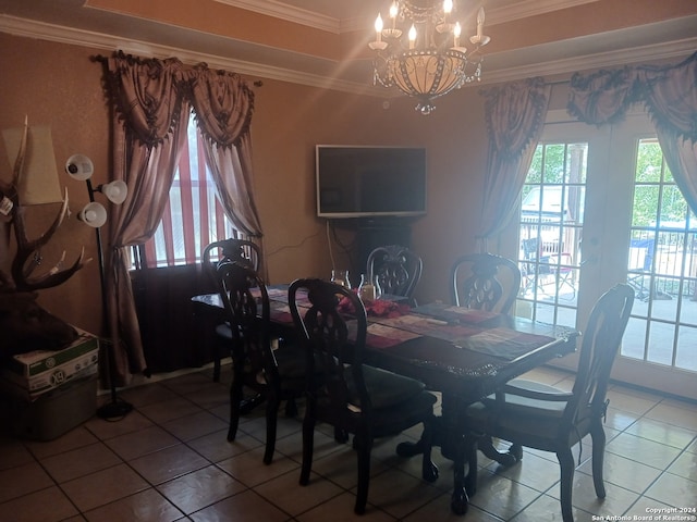 dining room featuring ornamental molding, tile patterned flooring, and a chandelier