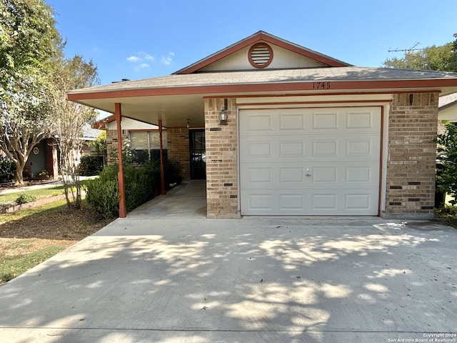 view of front facade with driveway, a carport, and brick siding