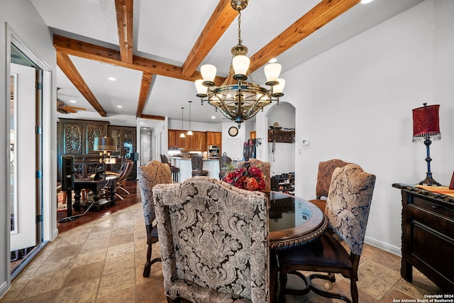 dining area with ceiling fan with notable chandelier and beamed ceiling