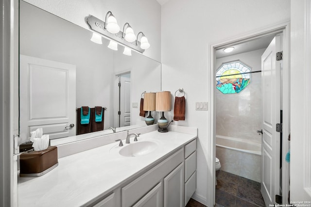 full bathroom with tile patterned floors, shower / bathtub combination, vanity, and toilet