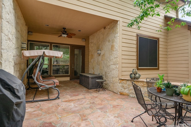 view of patio / terrace with ceiling fan and a grill