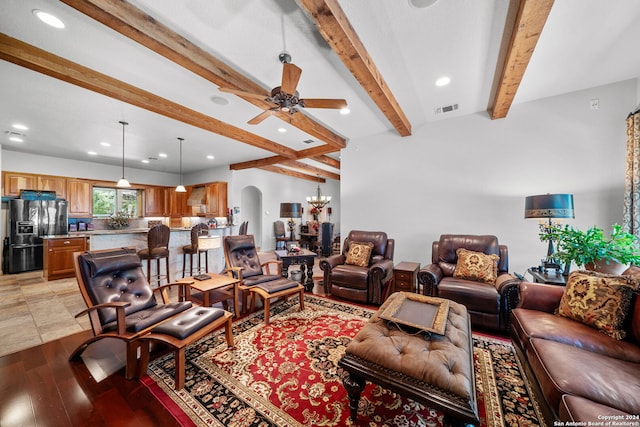 living room featuring ceiling fan, light hardwood / wood-style flooring, and beam ceiling