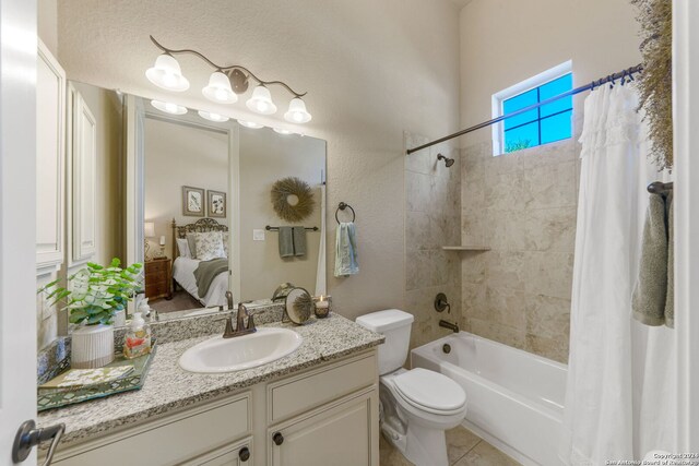 full bathroom with tile patterned floors, shower / tub combo, toilet, and vanity