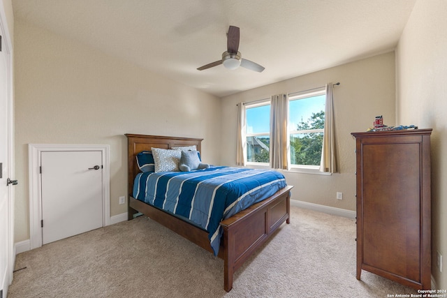 carpeted bedroom with ceiling fan