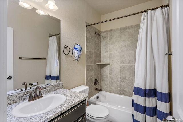 full bathroom featuring shower / tub combo, vanity, and toilet