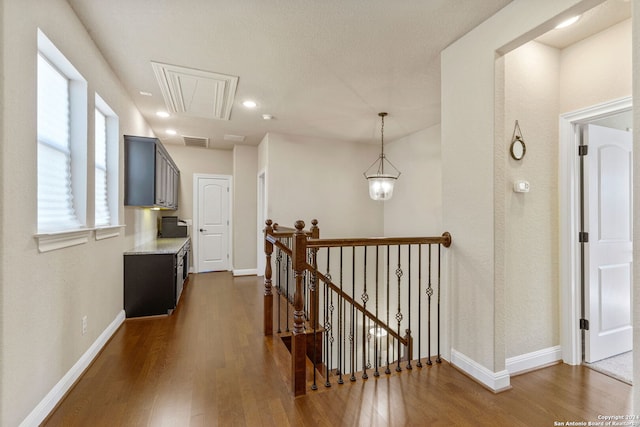 corridor featuring dark hardwood / wood-style flooring