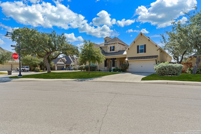 view of front facade with a garage and a front yard