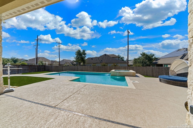 view of pool with an in ground hot tub and a patio area