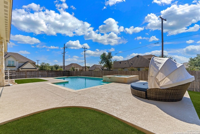 view of pool with an in ground hot tub and a patio area