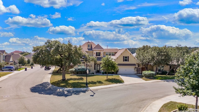 view of front of property with a front yard and a garage