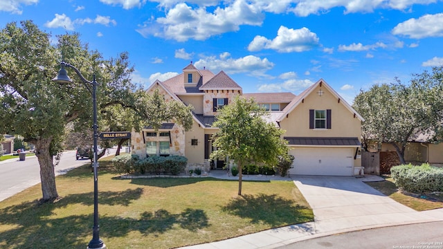 view of front of house with a front lawn and a garage