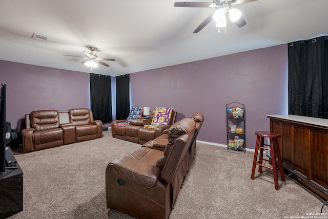 living room with ceiling fan and light colored carpet