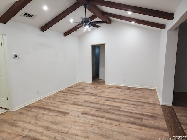 unfurnished room with vaulted ceiling with beams, light hardwood / wood-style floors, and ceiling fan