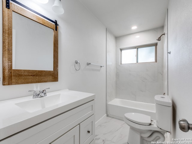 full bathroom featuring vanity, tiled shower / bath combo, and toilet