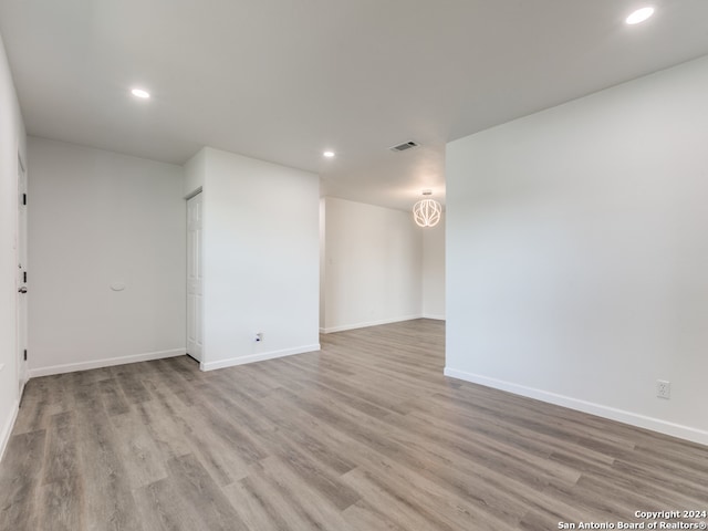 unfurnished room with light hardwood / wood-style flooring