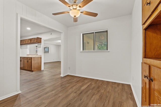 unfurnished room featuring wood-type flooring and ceiling fan