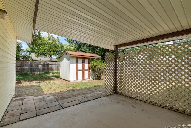 view of patio with a storage unit