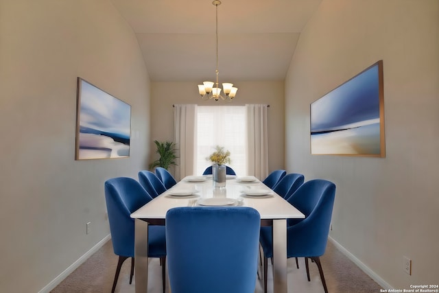 dining space featuring light carpet, baseboards, a chandelier, and lofted ceiling