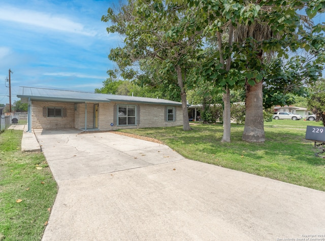 ranch-style home with a front yard and a carport