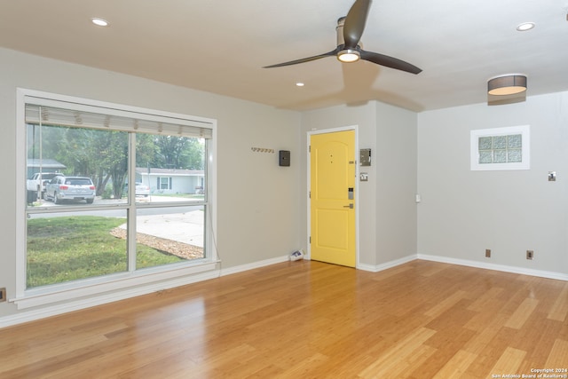 spare room featuring light wood-type flooring and ceiling fan