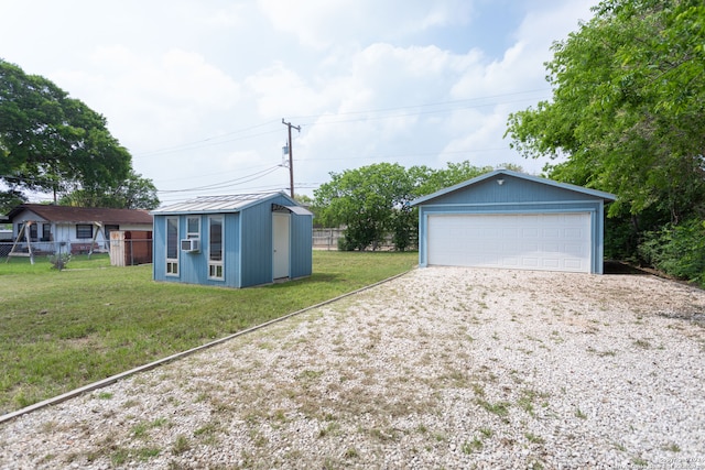 garage with cooling unit and a lawn