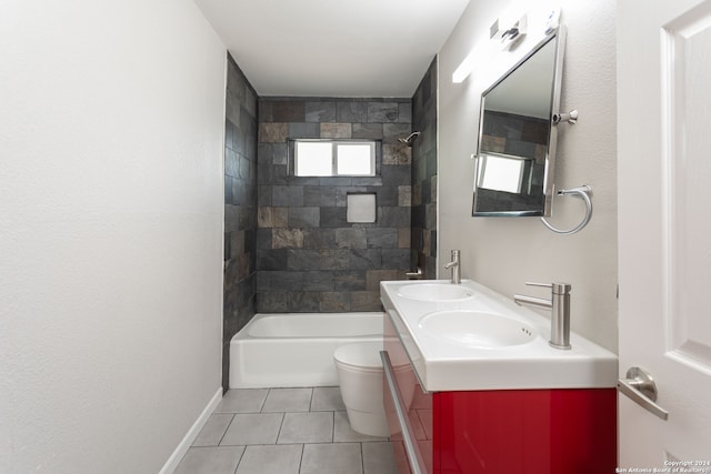 full bathroom featuring tiled shower / bath, vanity, tile patterned flooring, and toilet