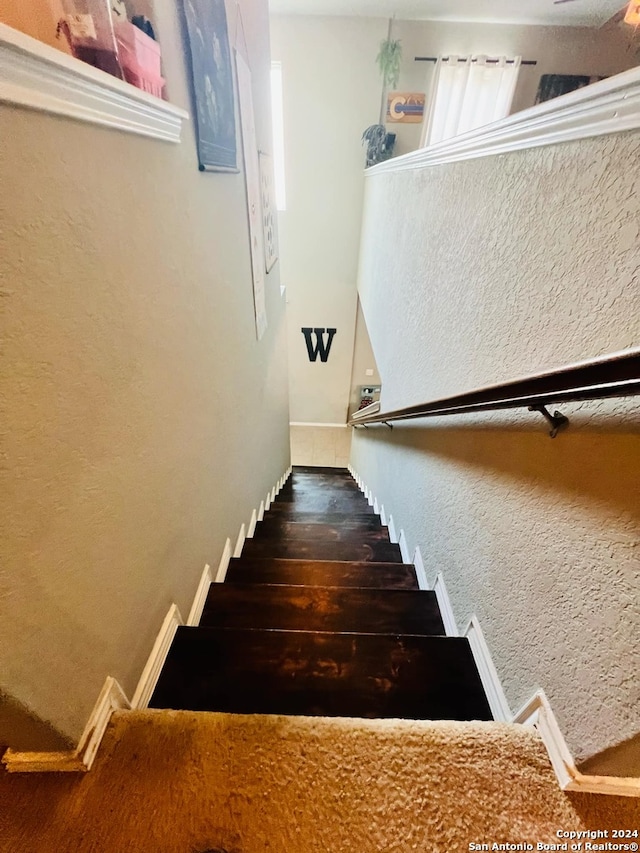 stairway featuring hardwood / wood-style flooring