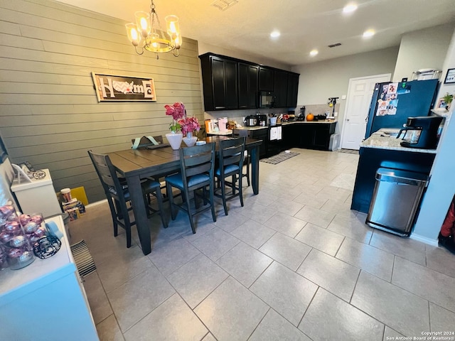 dining space featuring an inviting chandelier