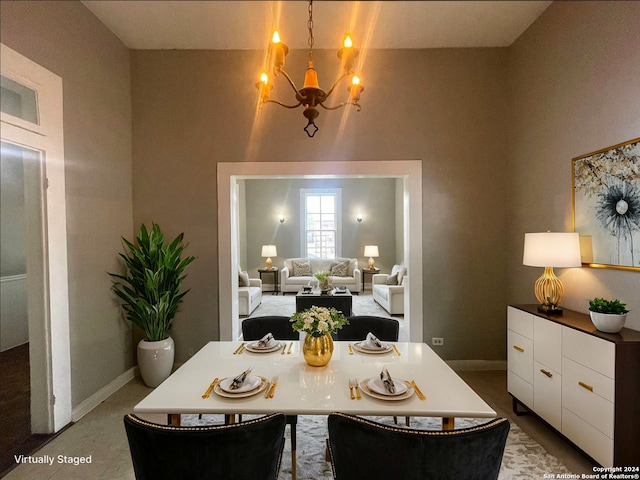 617 Montana St, San Antonio, TX 78203 - dining space featuring an inviting chandelier, a high ceiling, and baseboards