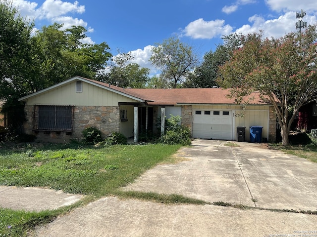 ranch-style house with a front lawn and a garage