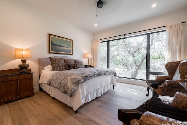 bedroom featuring light hardwood / wood-style flooring and ceiling fan