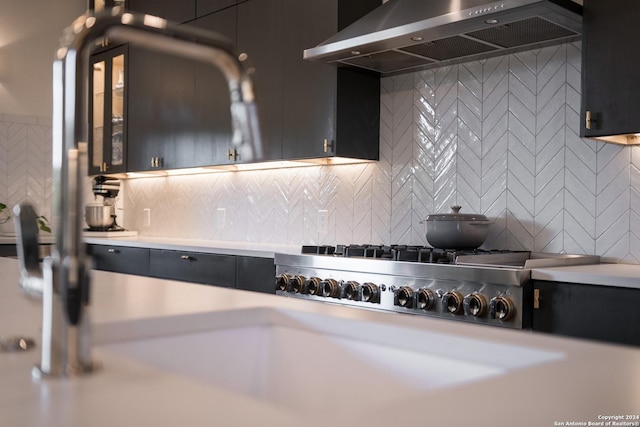 kitchen with tasteful backsplash and wall chimney exhaust hood