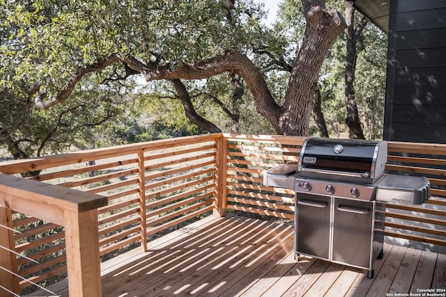 wooden deck featuring grilling area