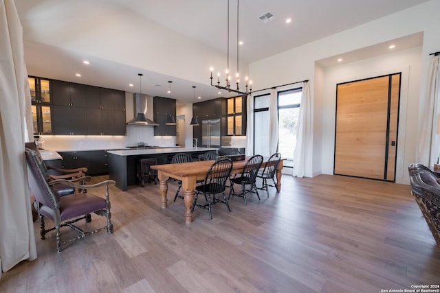 dining area featuring a chandelier and light hardwood / wood-style floors