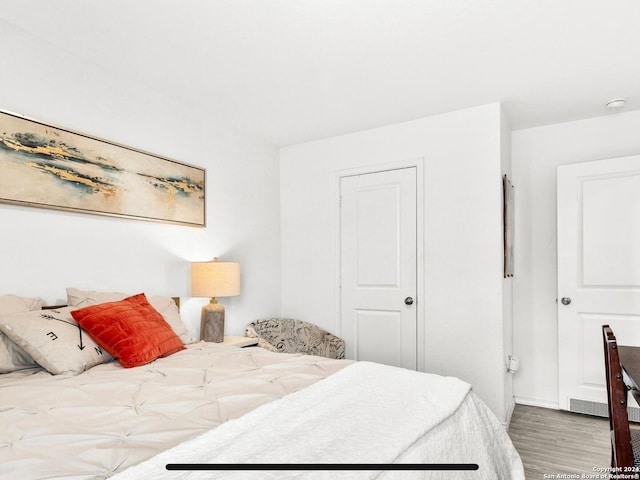 bedroom featuring hardwood / wood-style flooring