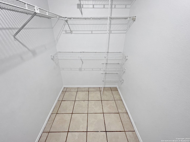 walk in closet featuring light tile patterned floors