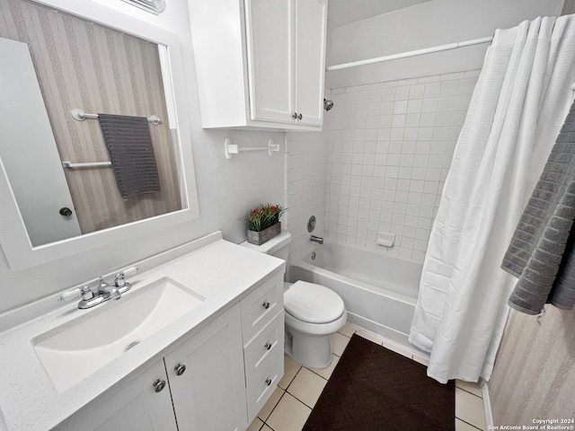 full bathroom with shower / bath combo with shower curtain, tile patterned flooring, vanity, and toilet