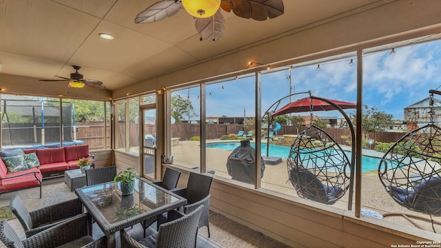 sunroom / solarium with ceiling fan