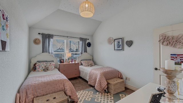 bedroom with carpet and vaulted ceiling