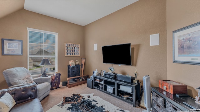 carpeted living room featuring vaulted ceiling