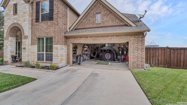 view of front of property with a front lawn and a garage