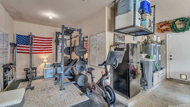 exercise room featuring concrete floors