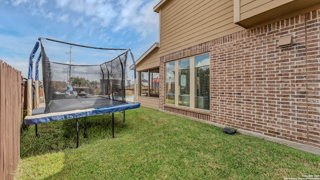 view of yard with a trampoline