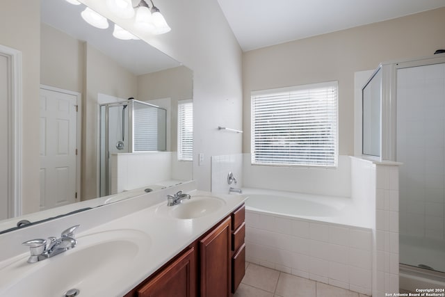 bathroom featuring tile patterned flooring, vanity, and separate shower and tub