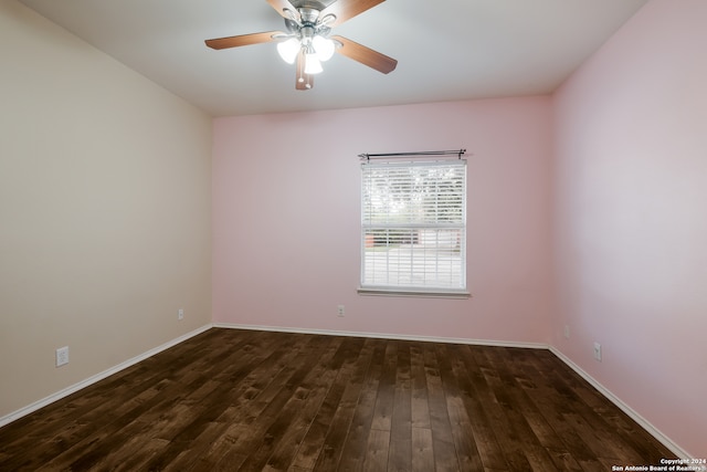 unfurnished room featuring dark hardwood / wood-style floors and ceiling fan