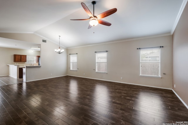 unfurnished living room featuring a healthy amount of sunlight, ceiling fan with notable chandelier, and dark wood-type flooring