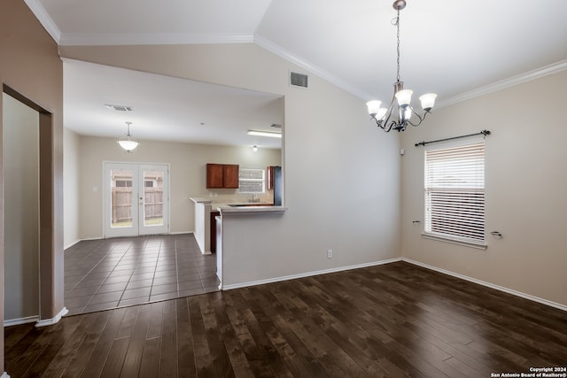 unfurnished room with lofted ceiling, a chandelier, crown molding, and dark hardwood / wood-style flooring